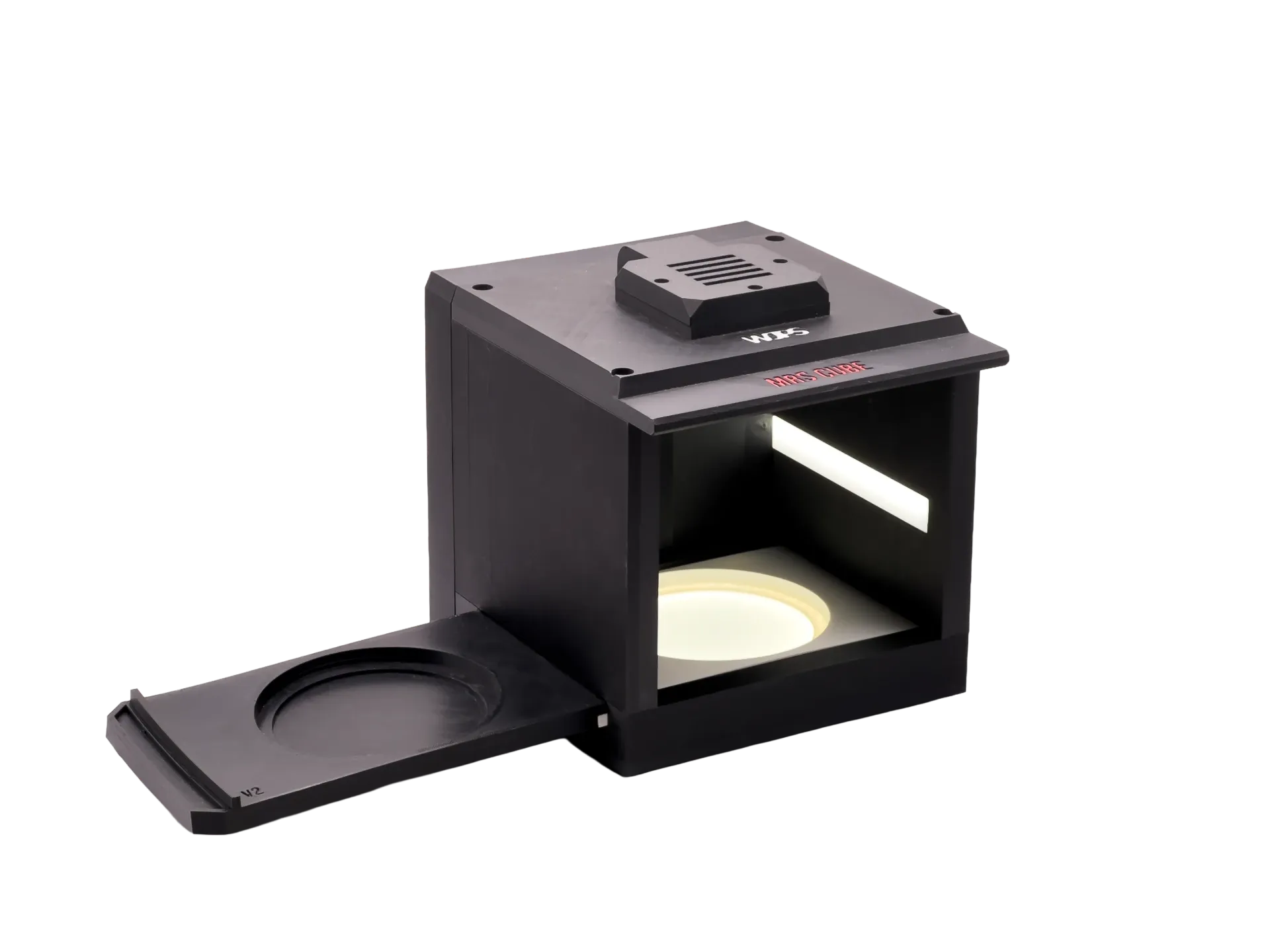 The Cube: a black enclosure with a slot at the front for the plate
